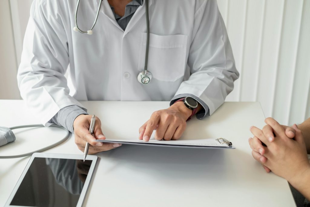 Doctor advise and medical concepts to the patient At the office.